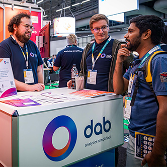 FabCon sponsors booth group of me discussing and talking, learning