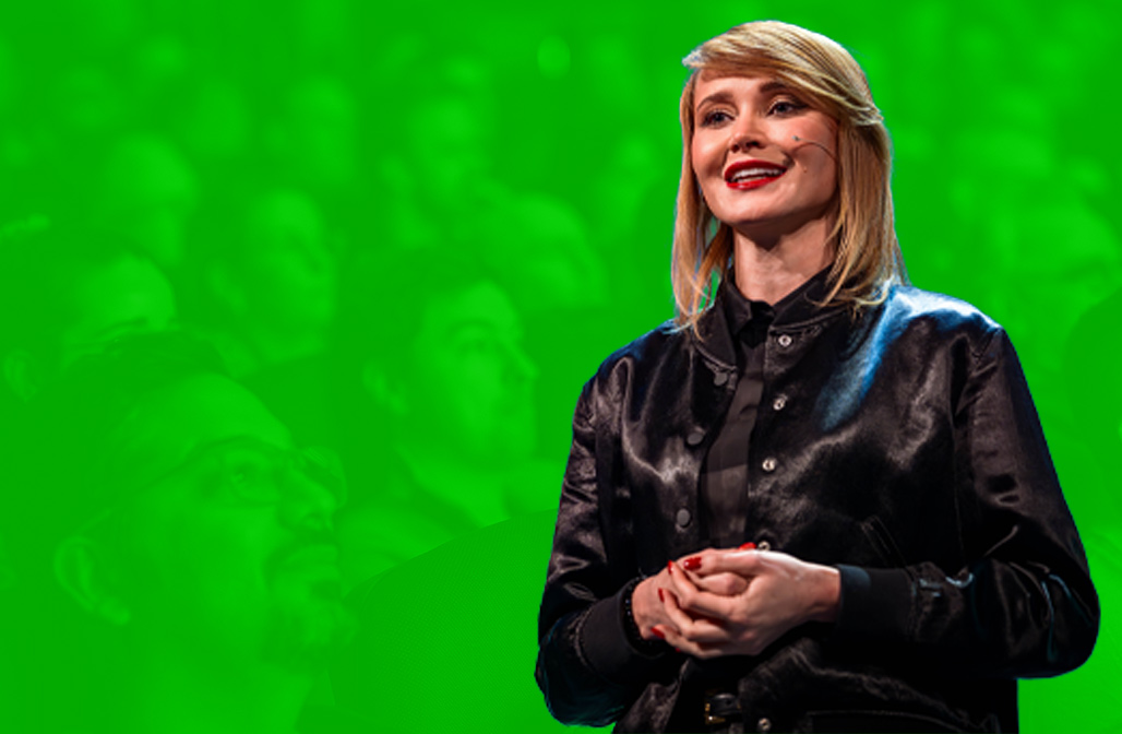 ESPC speaker during a keynote speech, with watermark image in the background of audience